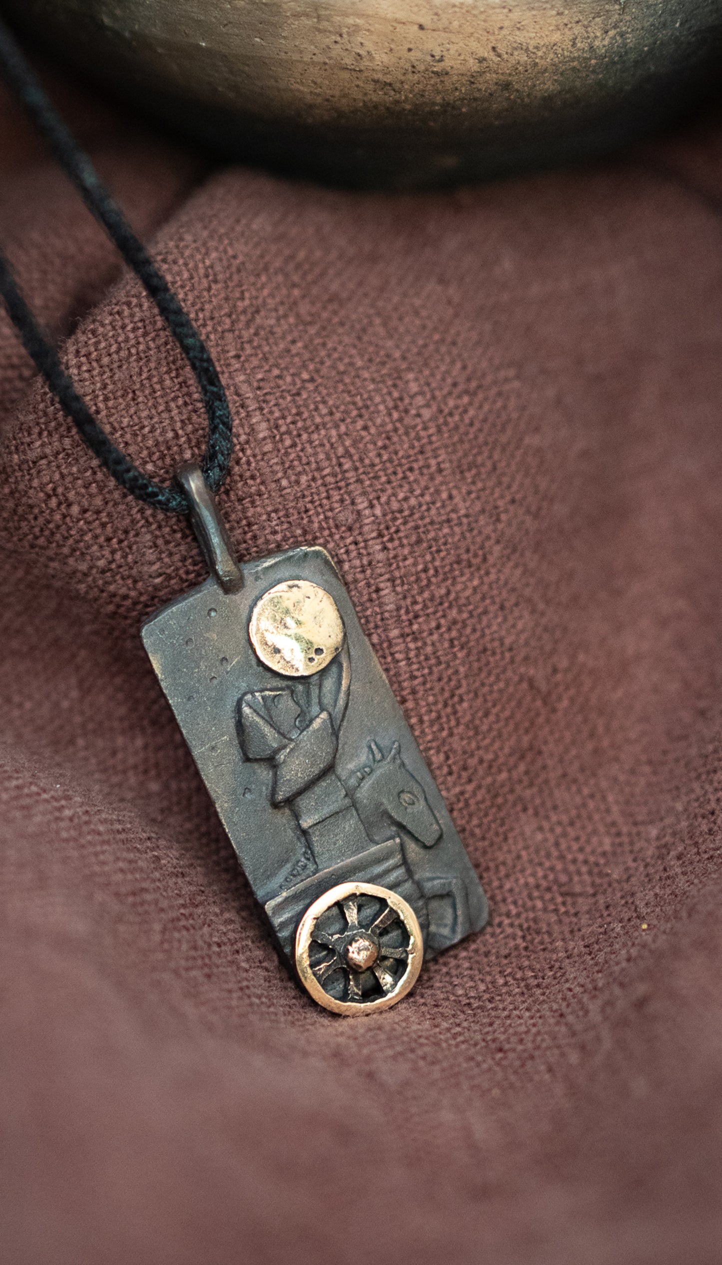 Mani bronze pendant